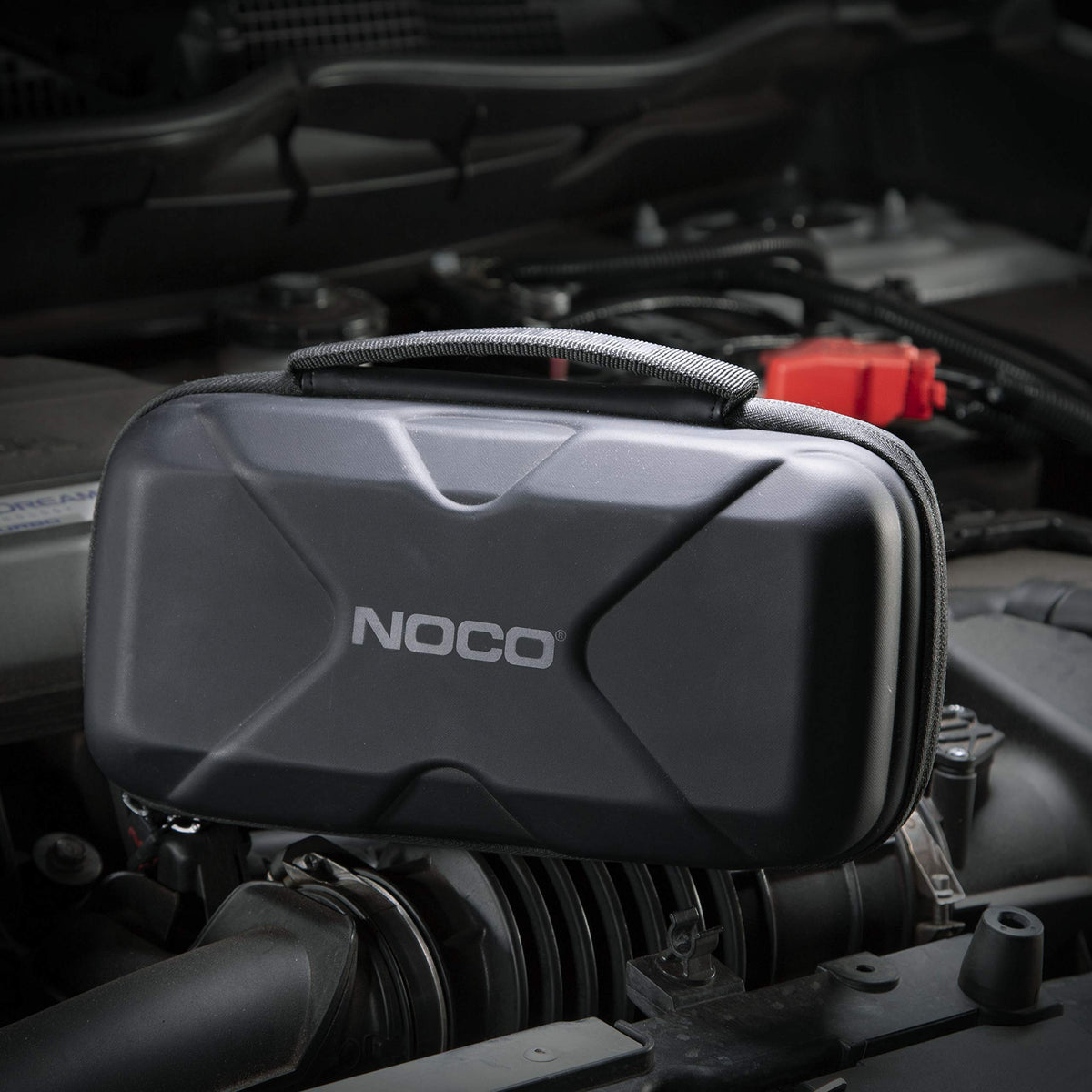 NOCO case in car trunk as roadside kit for quick emergency access
