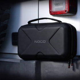 NOCO lifestyle image of case next to car during roadside emergency readiness