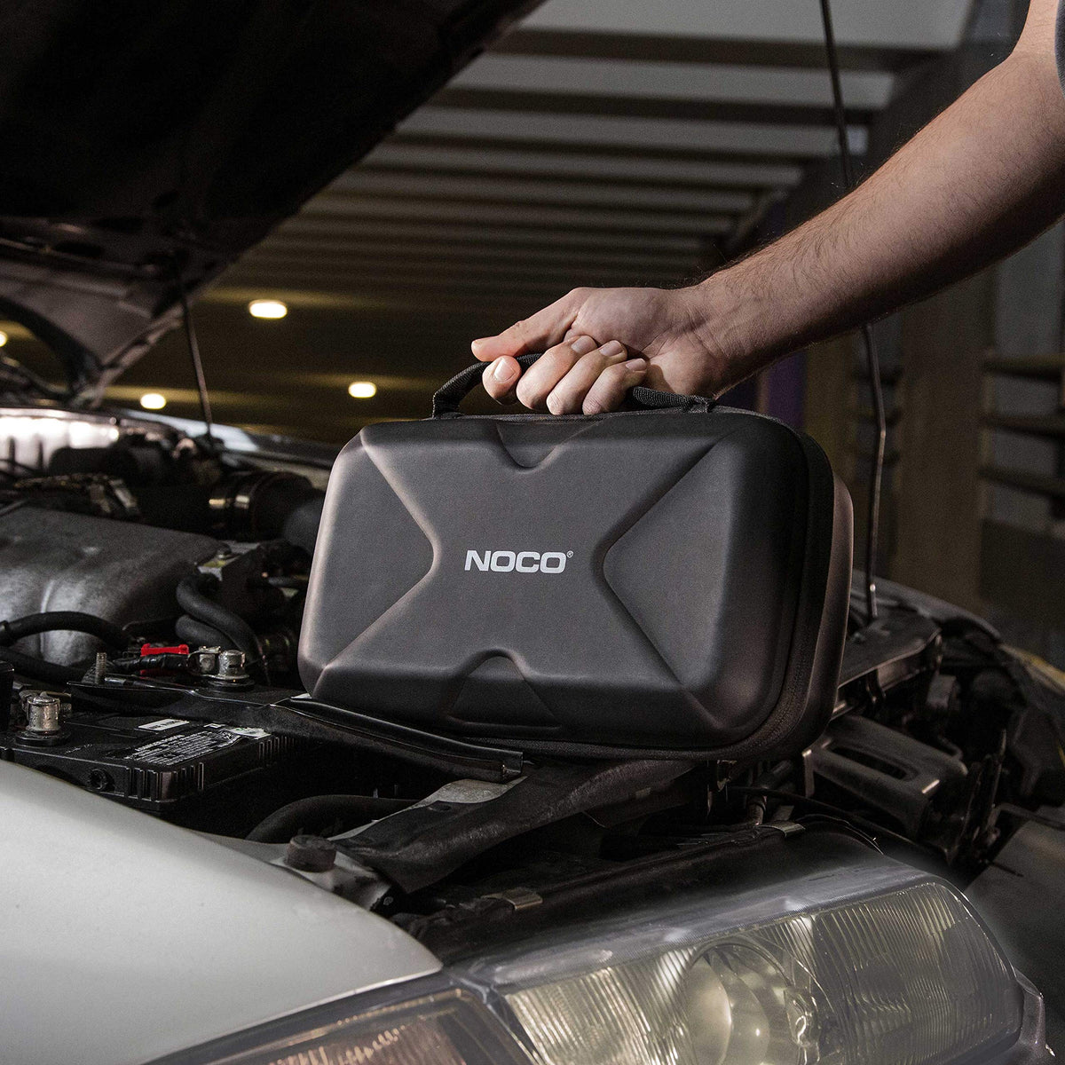 NOCO case fitting inside vehicle glove box for convenient storage