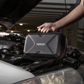 NOCO case fitting inside vehicle glove box for convenient storage