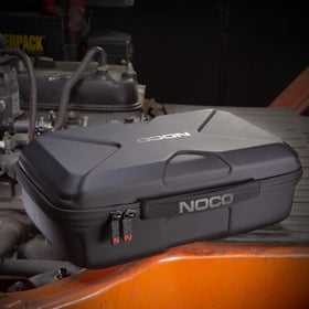 NOCO case stored in vehicle glovebox for tidy emergency preparedness