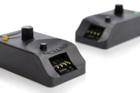 Noctua NA-FC1 size comparison to US coin illustrating compact footprint and easy desktop integration