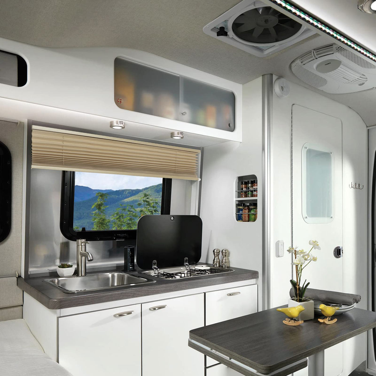 NOVINO blind mounted in camper window showing sun blocking benefit