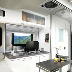 NOVINO mounted in RV window demonstrating privacy and light control benefit
