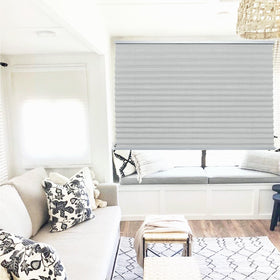 NOVINO blinds beside common objects for size comparison showing fit confidence