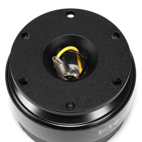 NRG Innovations installed in car with wheel removed demonstrating easy removal benefit