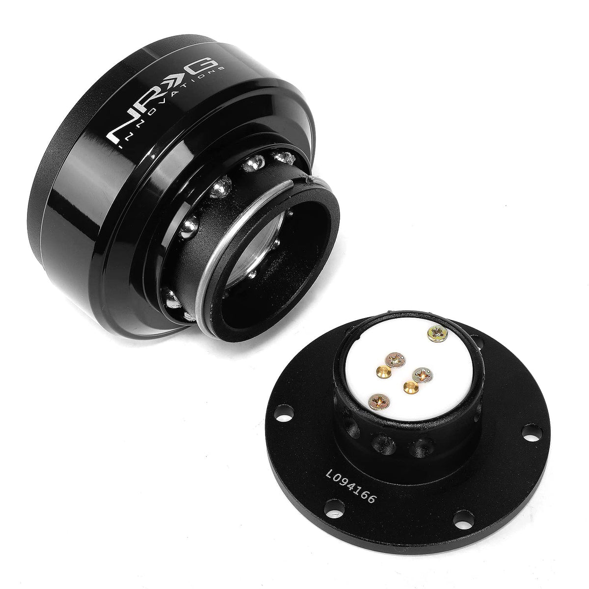 NRG Innovations quick release next to ruler showing compact size and fitment clarity