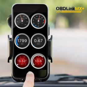 OBDLink MX+ in a garage setting being used by a technician for quick checks