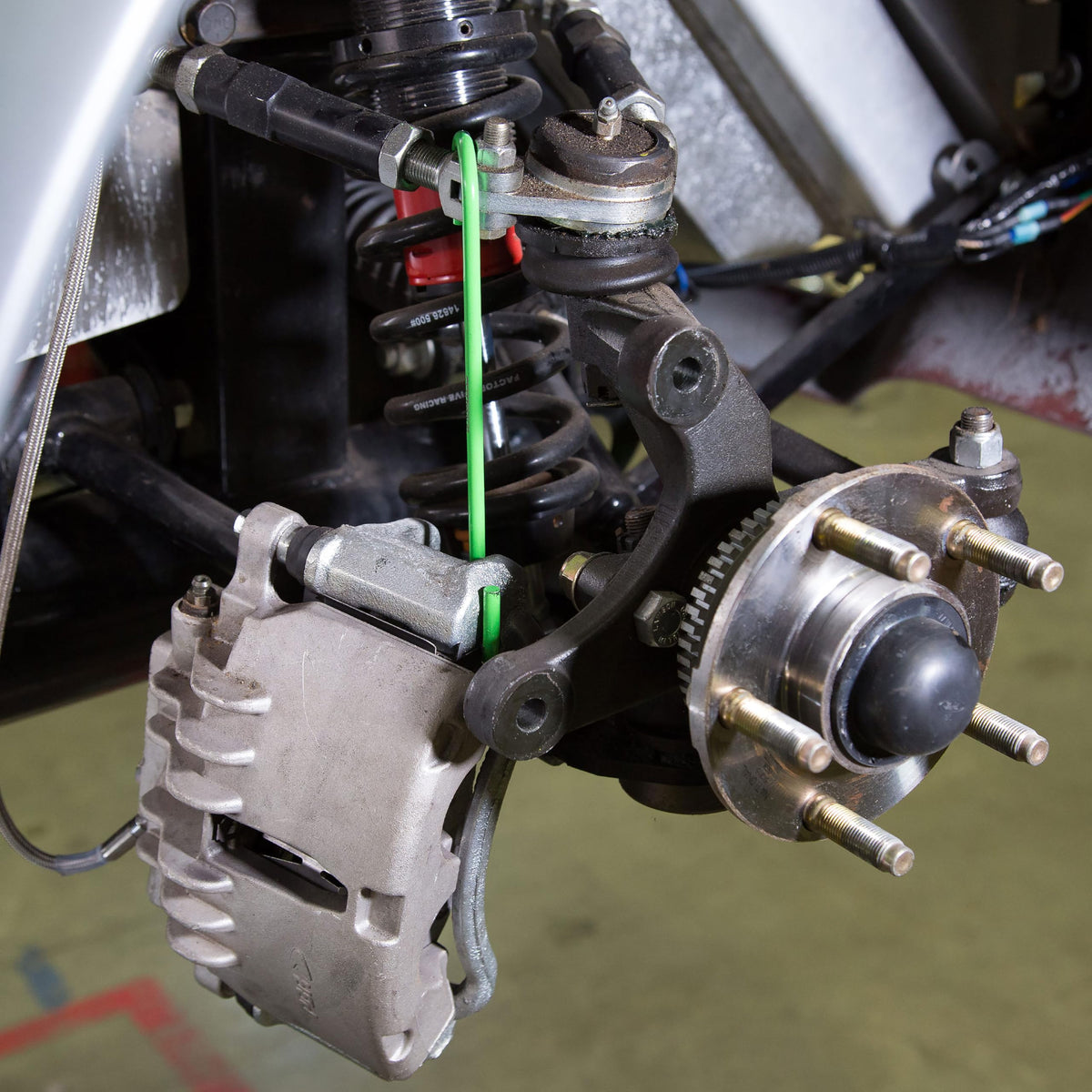 OEMTOOLS hanger supporting exhaust hose to protect lines and simplify multi-task repairs