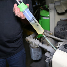 OEMTOOLS pump next to ruler showing compact size for toolbox portability