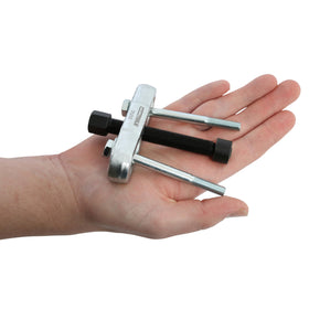 OEMTOOLS puller installed on a steering wheel hub showing proper vehicle use and safety