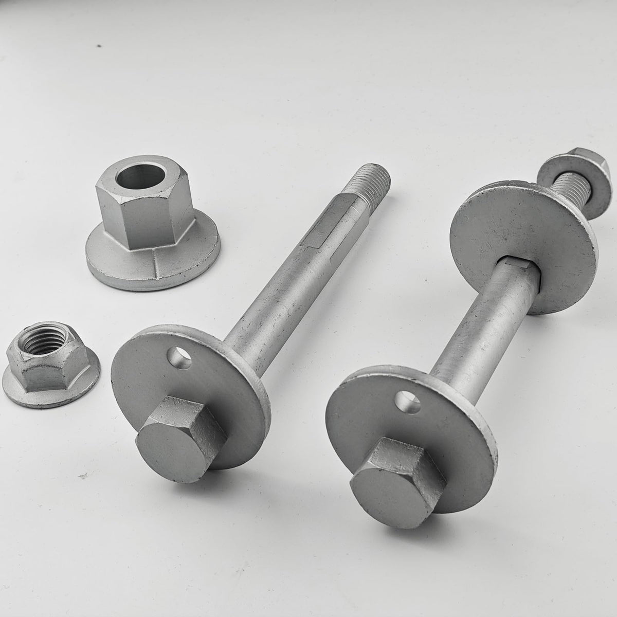 OEMUTA camber bolt next to ruler showing dimensions for fit confirmation and installation planning