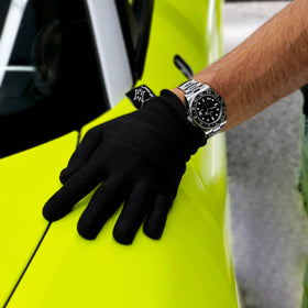 Off-Wrap gloves on a workbench with tools showing durability and lint-free handling
