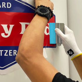 Off-Wrap squeegees on a shop bench with tools conveying durability and everyday use