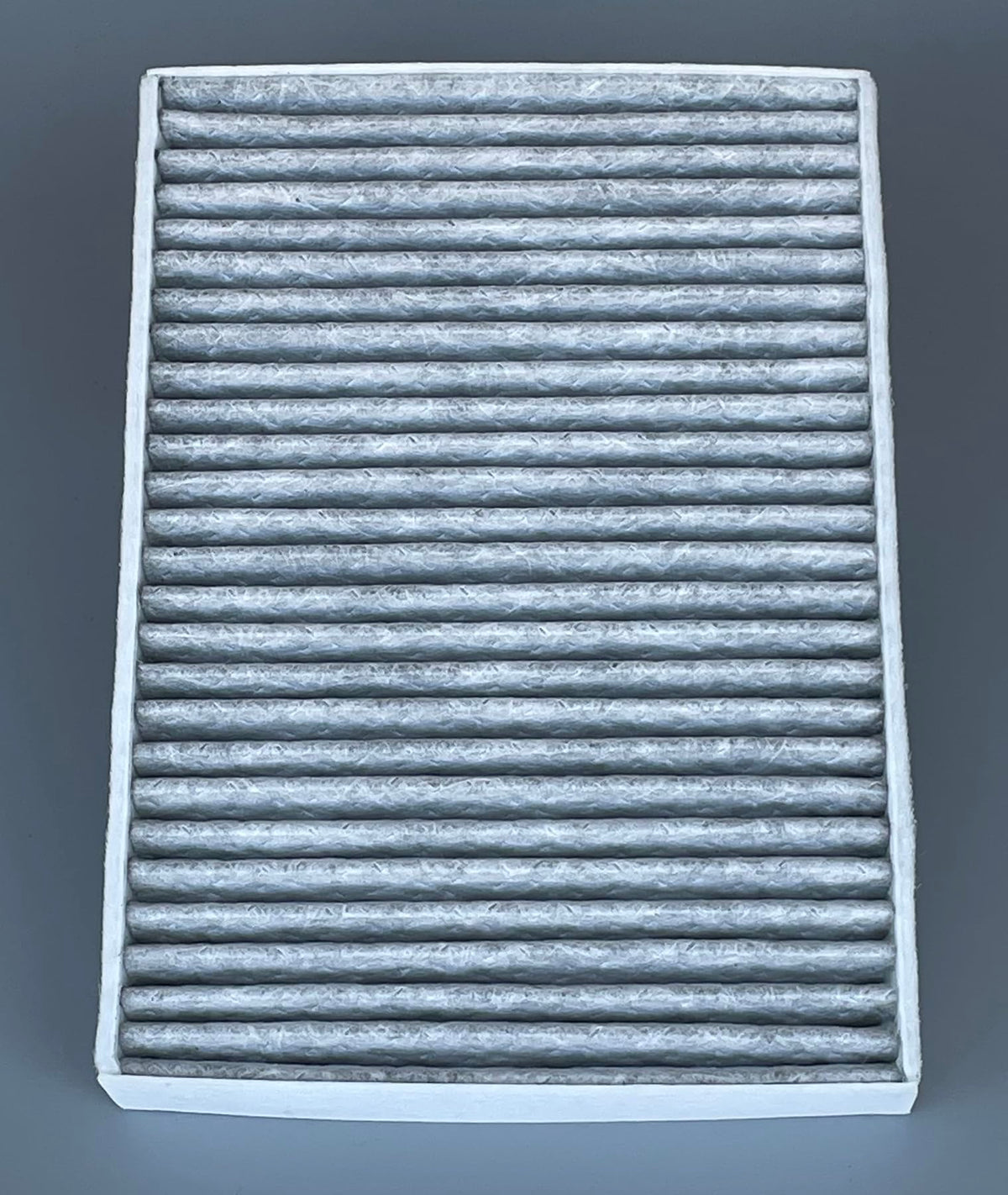 OIFILLIO filter next to ruler showing precise OEM-sized dimensions