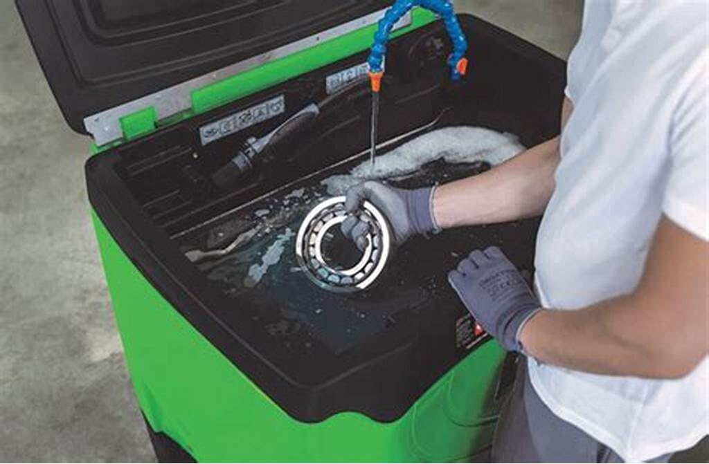 Oil Eater fluid in a heated parts washer delivering faster cleaning