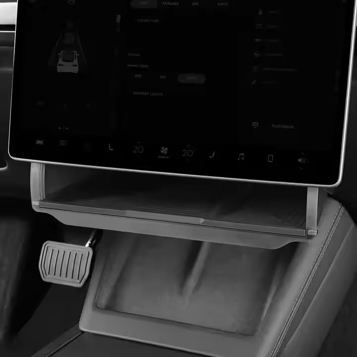 Old Rock front view installed under Model Y screen showing neat storage — adds convenience