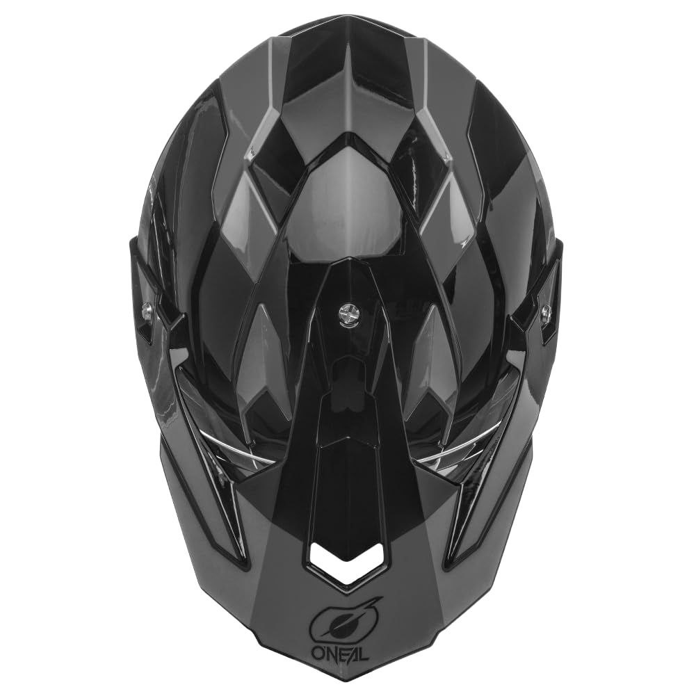 O'NEAL helmet next to a helmet scale showing correct large fit