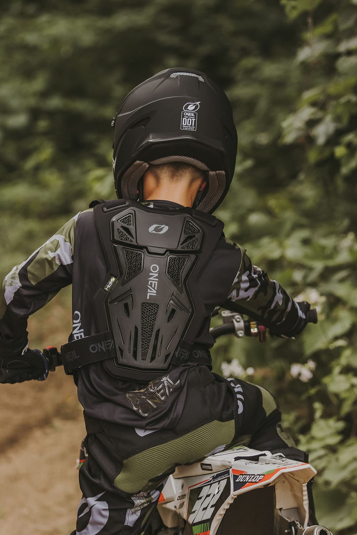 O'NEAL lifestyle trail shot showing youth rider protection in action