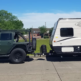 Onsski lifestyle shot towing a trailer showing reliable performance on road