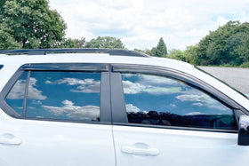 Optimal Co installed on driver side window shows rain deflection benefit