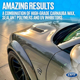 Hand holds 17 oz Optimum Car Wax to show convenient portable size