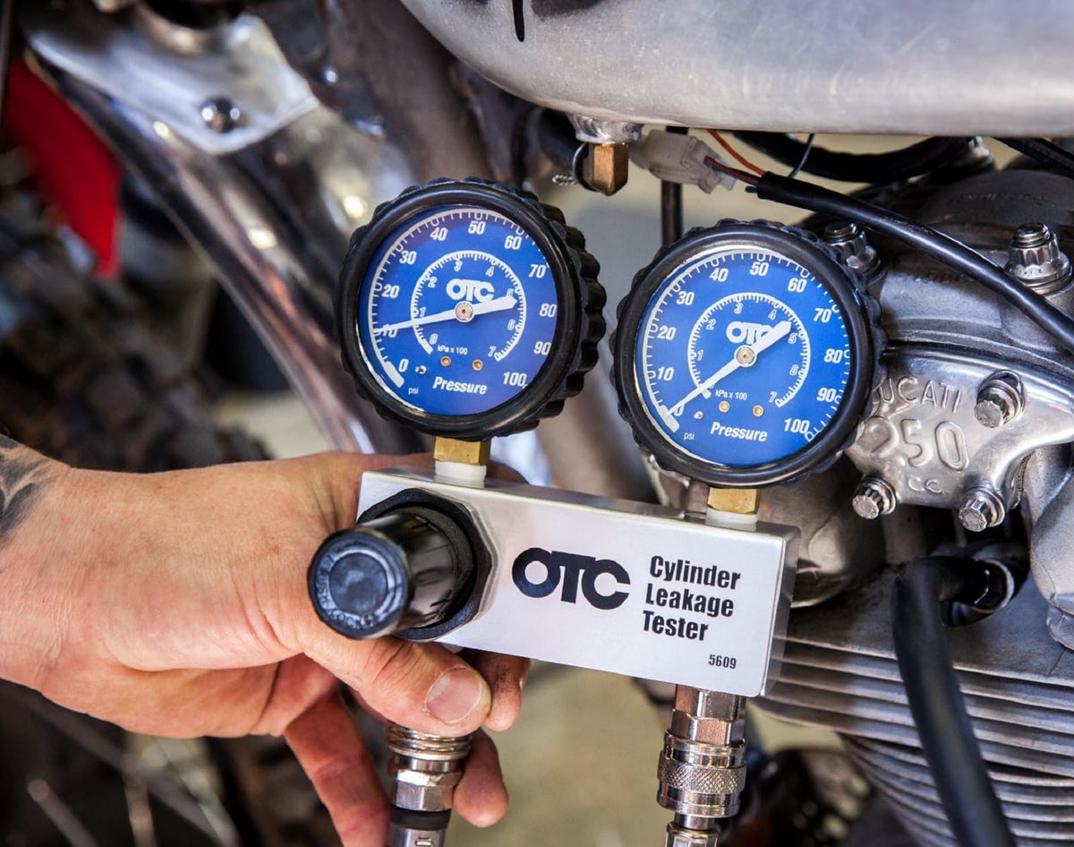 OTC 5609 aluminum manifold with quick couplers for secure, quick connections