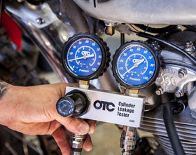 OTC 5609 aluminum manifold with quick couplers for secure, quick connections