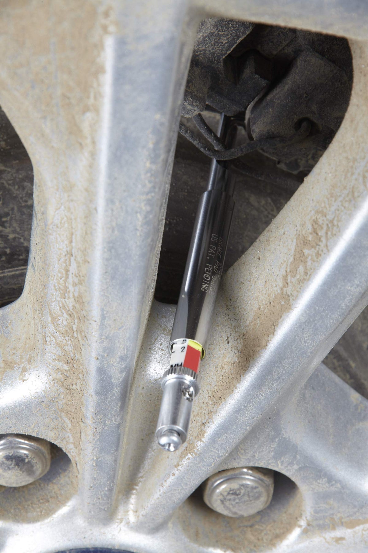 OTC 6596 size comparison beside wrench showing compact tool and easy storage