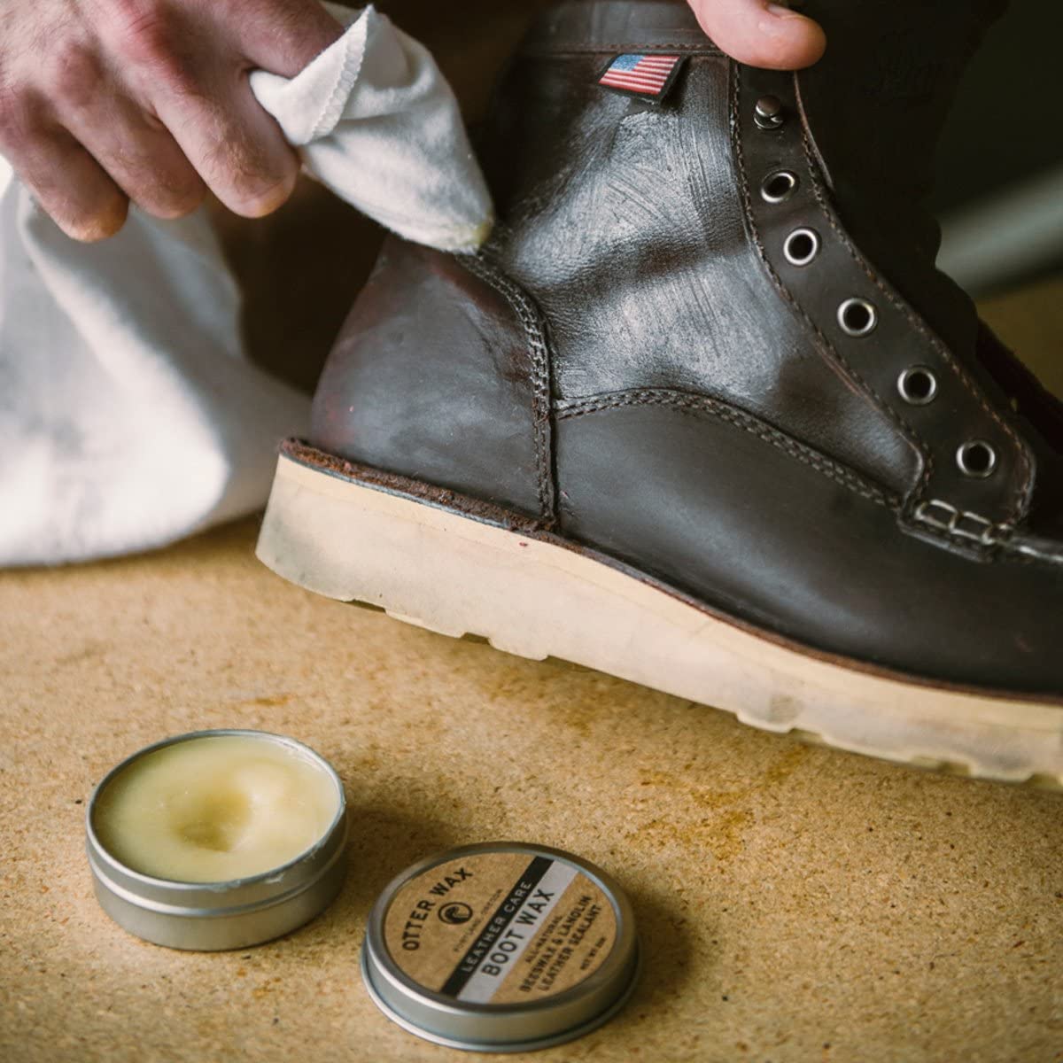 Otter Wax 5 oz tin next to a ruler to show compact, travel-friendly size