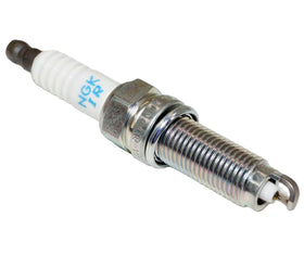 OVERSTOCKDIRECT NGK installed in engine under plug boot, demonstrates proper in-vehicle use