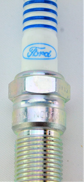 OVERSTOCKDIRECT spark plug installed in engine illustrating correct fit and reliable ignition