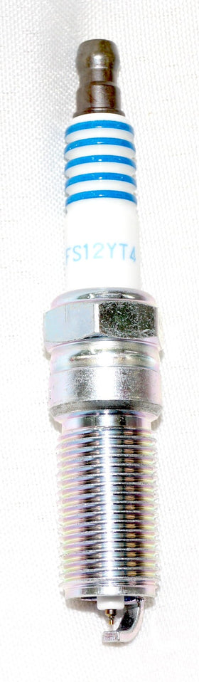 OVERSTOCKDIRECT plug installed in engine showcasing correct fit and reliable ignition performance
