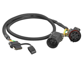 Oyviny front view of USCAR 7-pin to 4-pin harness showing plug benefits