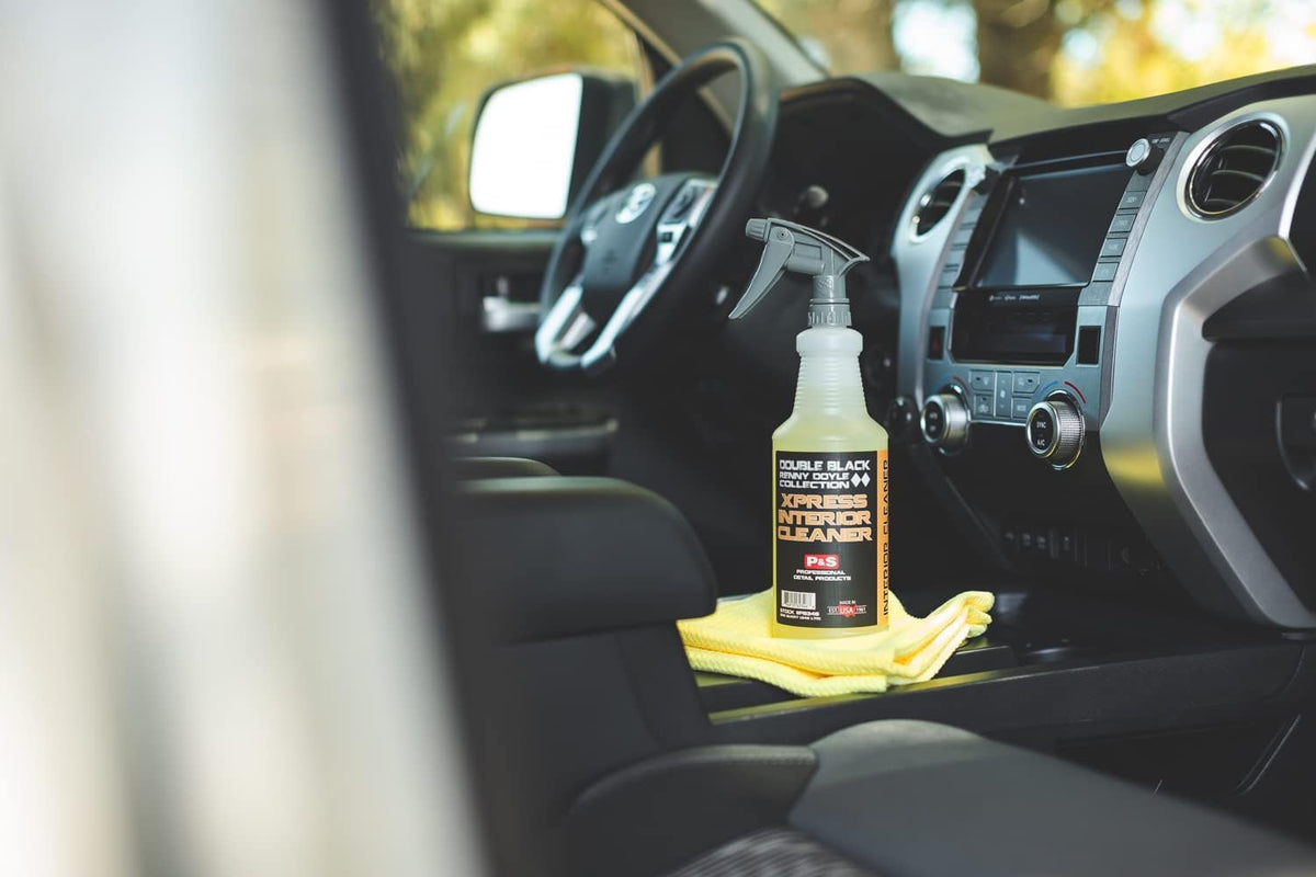 P & S Xpress Interior Cleaner being applied to a dashboard for safe cleaning