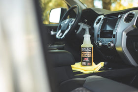 P & S Xpress Interior Cleaner being applied to a dashboard for safe cleaning