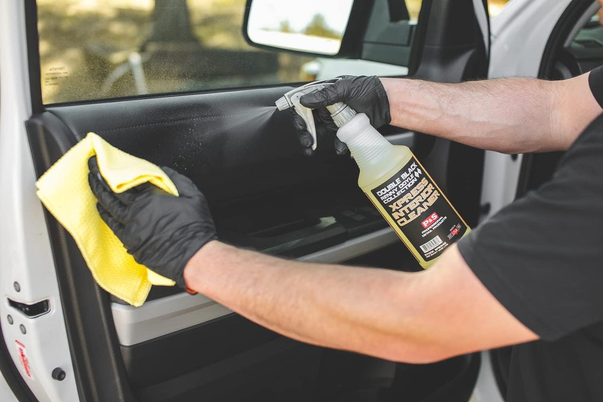 P & S Xpress Interior Cleaner 16 oz bottle next to hand for scale and convenience