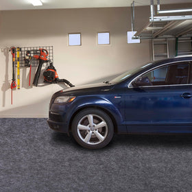 PANDOROOM mat beside a car to show full 7.4 x 17 ft size for broad coverage benefit