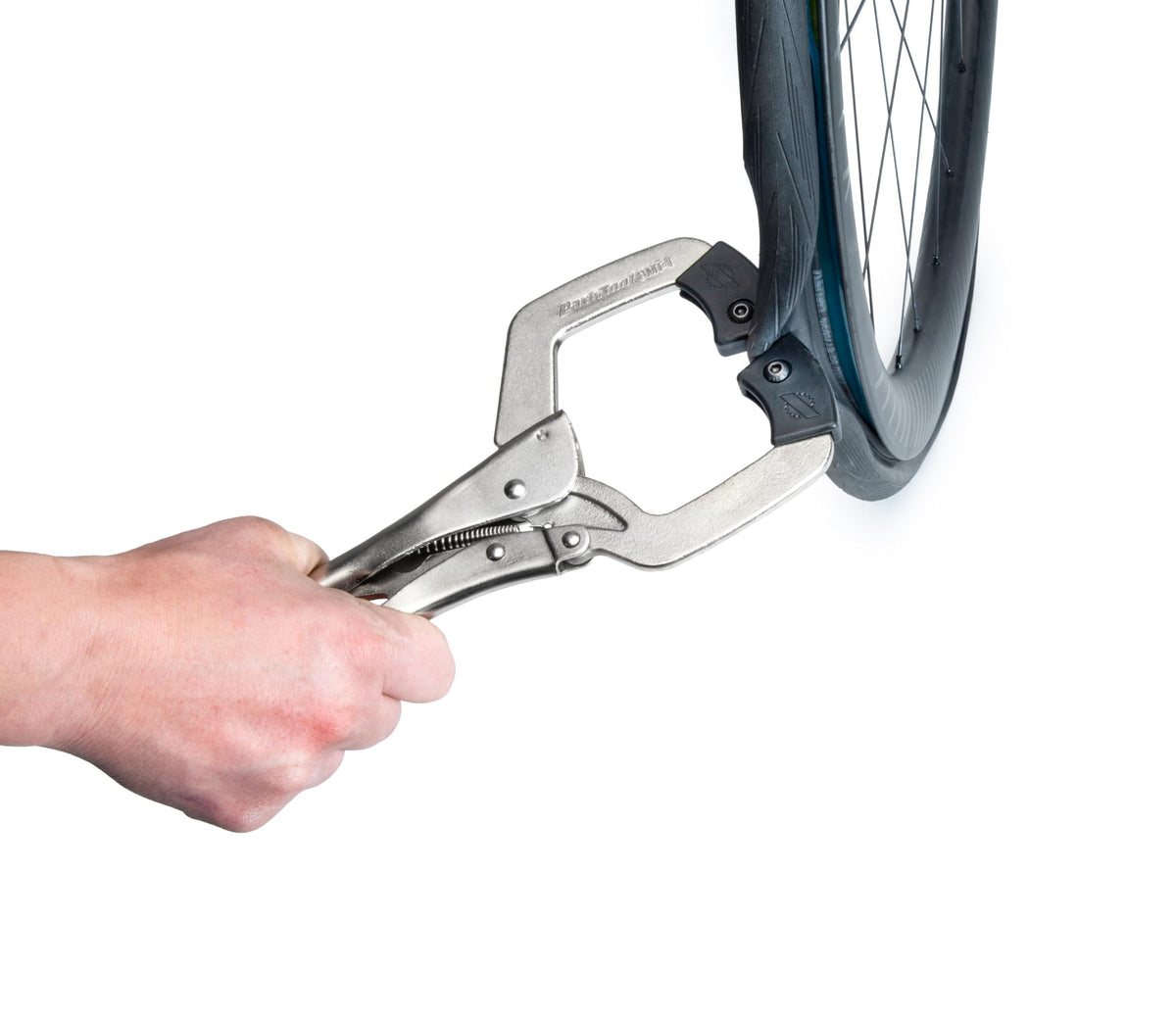Park Tool BMT-1 mounted on bike rim in a garage lifestyle setting reducing effort