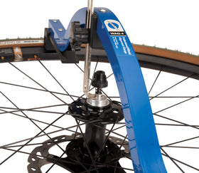 Park Tool WAG-4 mounted on a bicycle wheel illustrating quick on-bike alignment checks