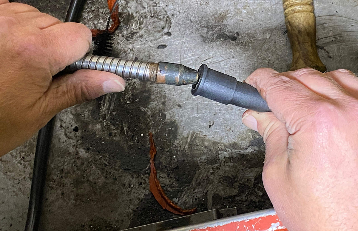 Parts Brush Oriflo in use with parts washer demonstrating targeted cleaning and solvent circulation