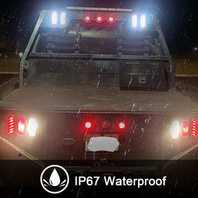 Partswcgg illuminated at night displaying strong red brake and white reverse contrast for safety