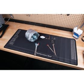 Performance Tool mat in a workshop holding parts and tools to keep bench clean