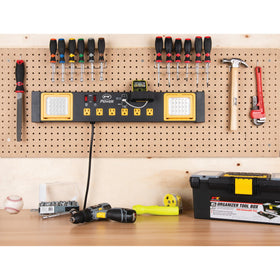 Performance Tool next to hand tools for scale, compact footprint benefit