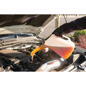 Performance Tool W4046 being poured into engine oil fill for controlled transfer