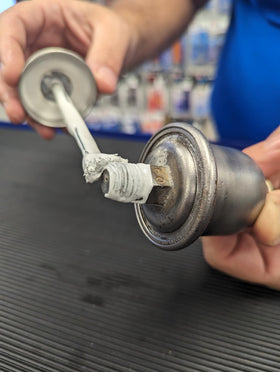 Permatex 80633 red paste close-up texture showing PTFE-infused sealant for reliable thread filling