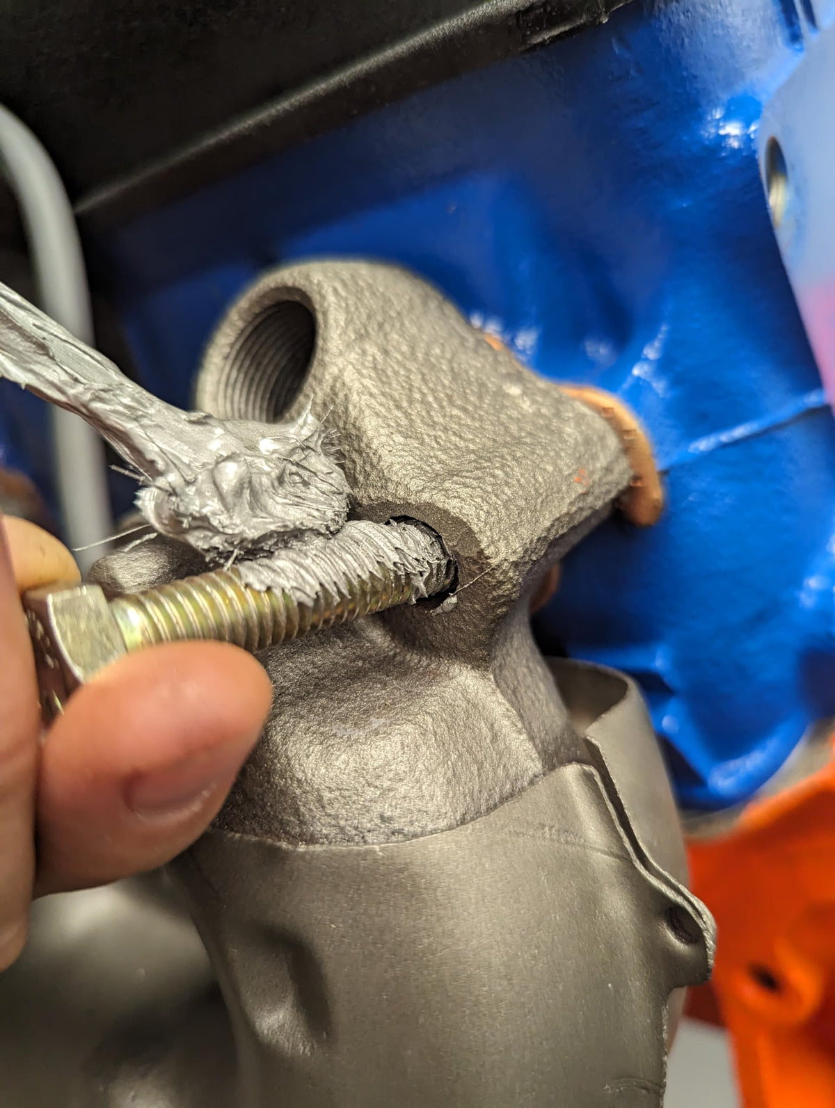 Permatex applied to spark plug threads showing protection and easier future removal