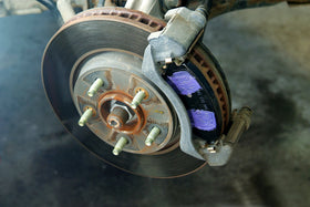 Permatex open cap revealing purple grease for easy application