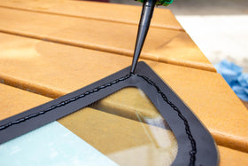 Permatex Glass Weld in use during windshield installation demonstrating fast cure and strong bond