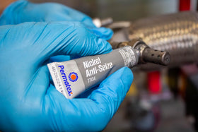 Permatex nickel anti-seize applied to exhaust bolt eases future removal benefit